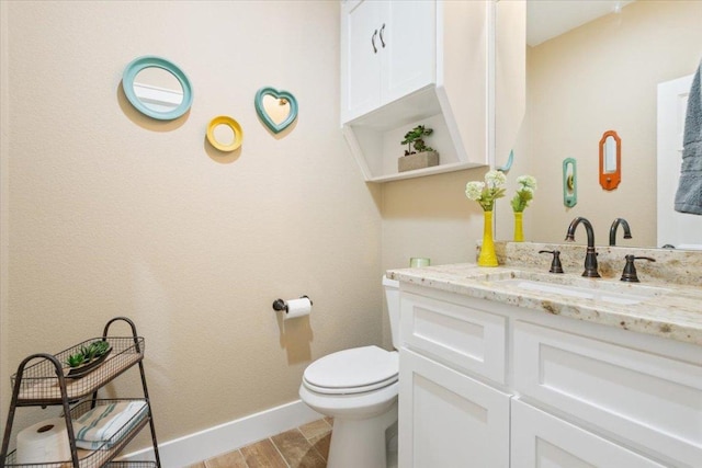 160 Buccaneer Way, Waco, TX 76638 - half bath with toilet, vanity, baseboards, and wood finished floors