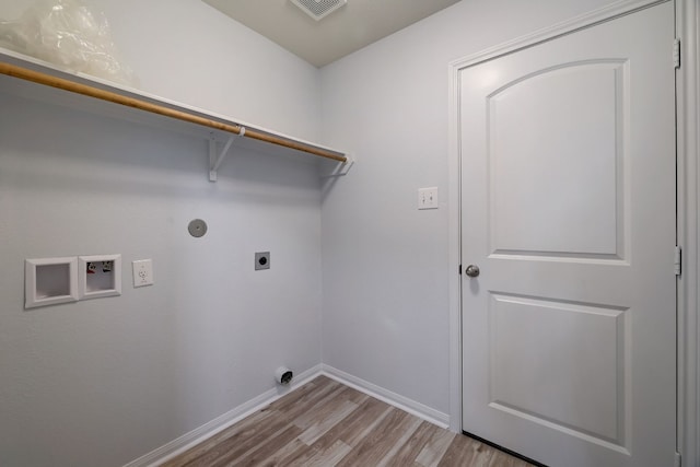 washroom featuring wood finished floors, electric dryer hookup, laundry area, washer hookup, and baseboards