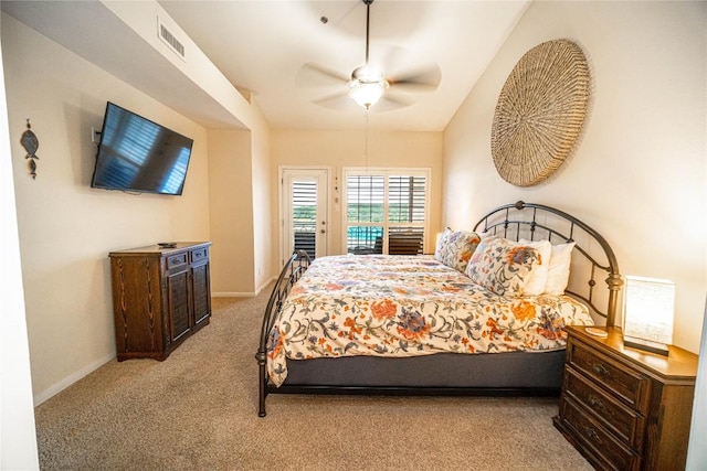 carpeted bedroom with baseboards, visible vents, a ceiling fan, and access to exterior