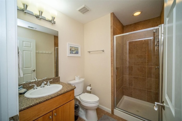 full bathroom featuring a shower stall, toilet, vanity, and visible vents