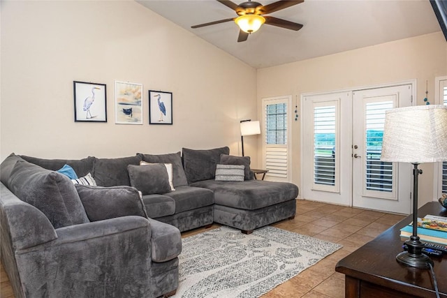 living area featuring tile patterned flooring, french doors, lofted ceiling, and ceiling fan