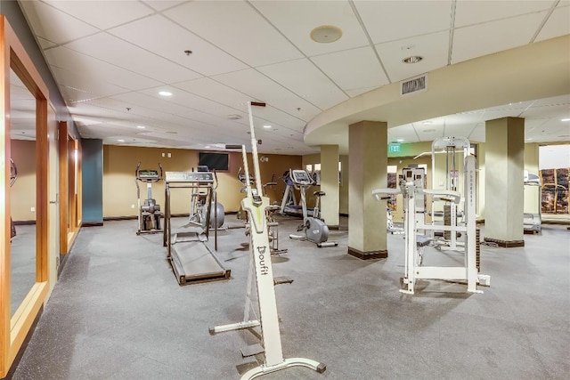workout area with recessed lighting, visible vents, baseboards, and a paneled ceiling