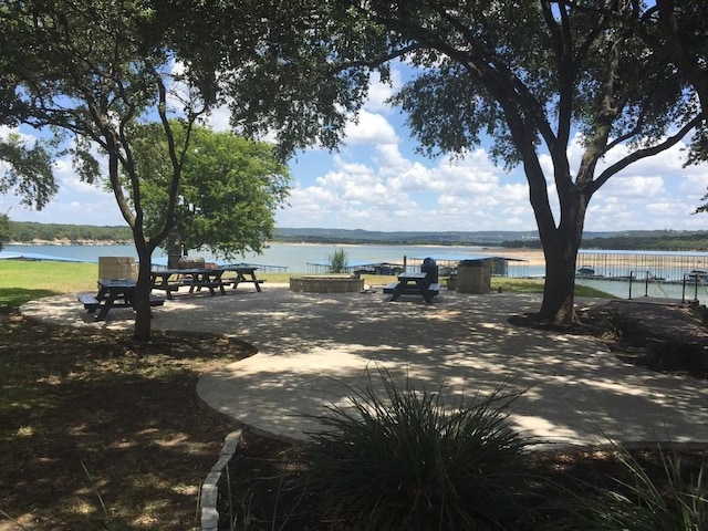 surrounding community with a water view