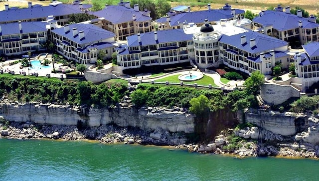 birds eye view of property with a water view