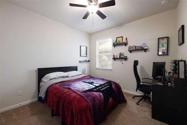 bedroom with baseboards, a ceiling fan, and carpet