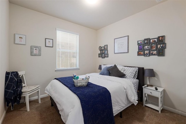 bedroom with baseboards and carpet floors
