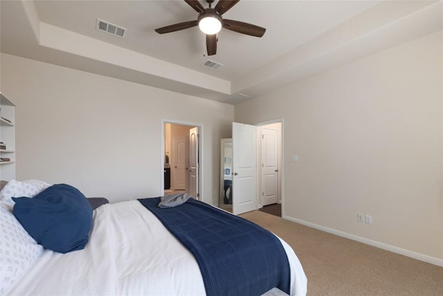carpeted bedroom featuring visible vents, baseboards, and a ceiling fan