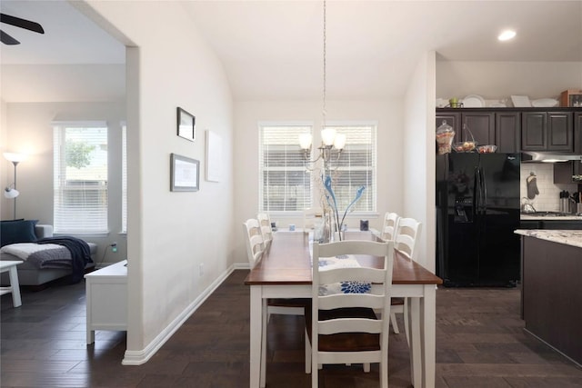 dining room featuring ceiling fan with notable chandelier, baseboards, dark wood-style flooring, vaulted ceiling, and recessed lighting