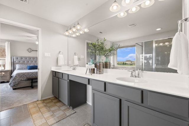 314 Andele Way, Liberty Hill, TX 78642 - ensuite bathroom featuring a sink, double vanity, connected bathroom, and a healthy amount of sunlight