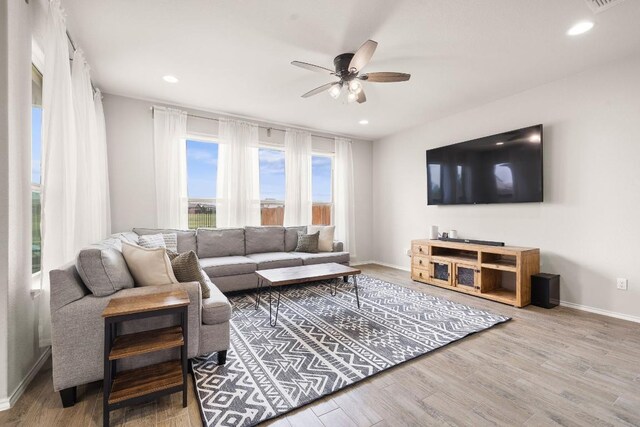 314 Andele Way, Liberty Hill, TX 78642 - living area with ceiling fan, recessed lighting, baseboards, and wood finished floors