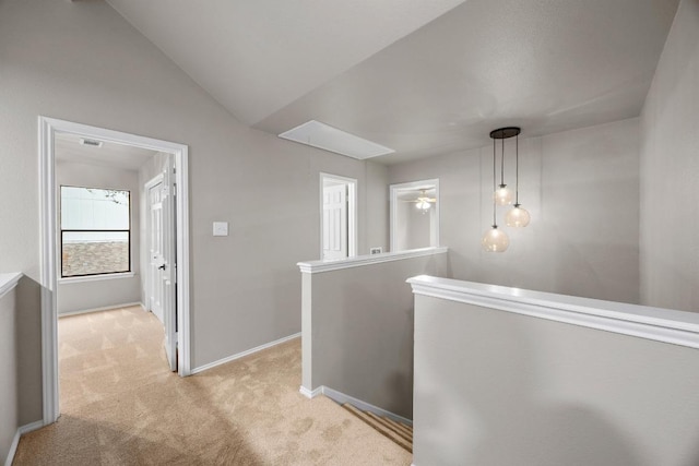 13105 Lubbock Ln, Austin, TX 78729 - hall with light colored carpet, an upstairs landing, and vaulted ceiling