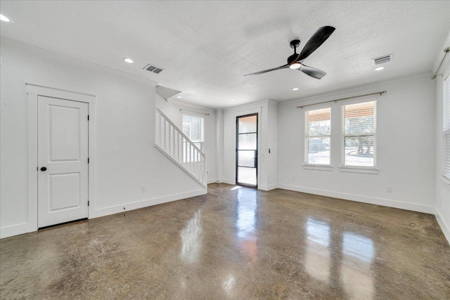 294 Shady Bluff Dr, Wimberley, TX 78676 - unfurnished living room with stairs, a textured ceiling, a ceiling fan, and visible vents