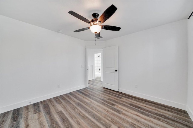 294 Shady Bluff Dr, Wimberley, TX 78676 - empty room featuring a ceiling fan, baseboards, visible vents, and wood finished floors