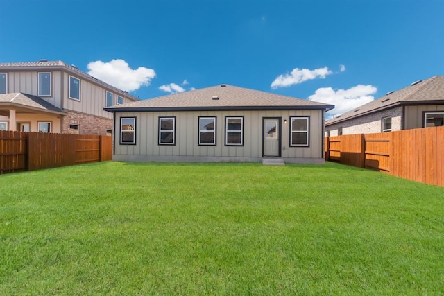2428 Ambling Trl, Georgetown, TX 78628 - rear view of house featuring board and batten siding and a shingled roof