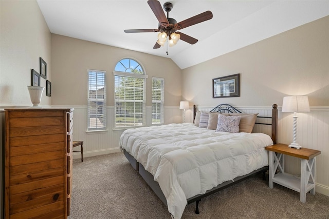 152 Florenz Ln, Georgetown, TX 78628 - carpeted bedroom with lofted ceiling, wainscoting, and ceiling fan