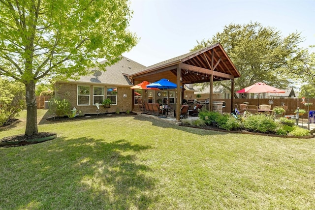 152 Florenz Ln, Georgetown, TX 78628 - back of property with a lawn, a patio area, and fence