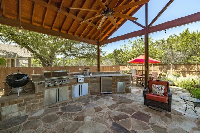 152 Florenz Ln, Georgetown, TX 78628 - view of patio / terrace with a fenced backyard, area for grilling, a grill, and a ceiling fan