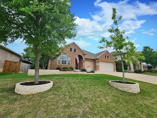 152 Florenz Ln, Georgetown, TX 78628 - view of front facade featuring driveway, brick siding, fence, an attached garage, and a front yard
