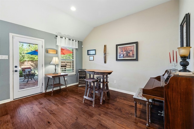 152 Florenz Ln, Georgetown, TX 78628 - dining room with lofted ceiling, baseboards, and wood finished floors