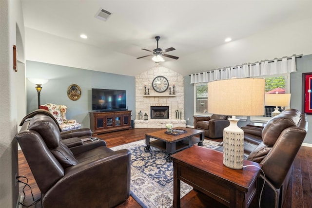 152 Florenz Ln, Georgetown, TX 78628 - living area featuring wood finished floors, a fireplace, visible vents, ceiling fan, and vaulted ceiling