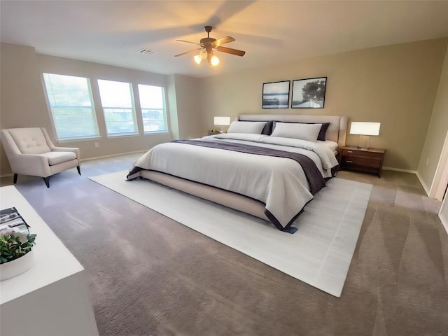 330 Mistletoe Ln, Kyle, TX 78640 - bedroom with baseboards, ceiling fan, visible vents, and light colored carpet