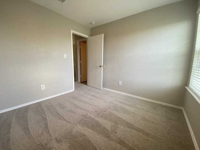 330 Mistletoe Ln, Kyle, TX 78640 - spare room with carpet floors and baseboards
