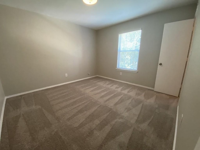 330 Mistletoe Ln, Kyle, TX 78640 - empty room featuring carpet and baseboards