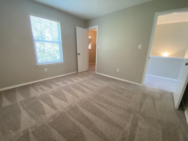 330 Mistletoe Ln, Kyle, TX 78640 - unfurnished bedroom with carpet and baseboards