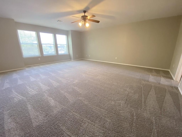 330 Mistletoe Ln, Kyle, TX 78640 - carpeted spare room featuring baseboards, visible vents, and ceiling fan