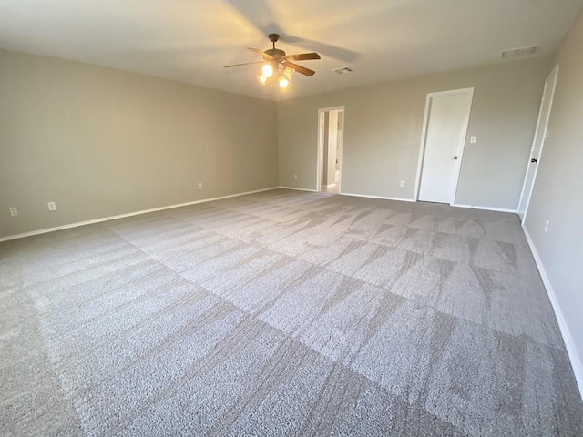 330 Mistletoe Ln, Kyle, TX 78640 - unfurnished room with carpet floors, a ceiling fan, and baseboards