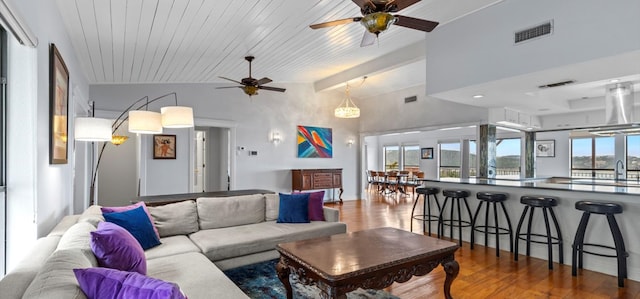 6714 Mtn Trl, Austin, TX 78732 - living room featuring a ceiling fan, wood finished floors, and beamed ceiling