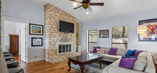 6714 Mtn Trl, Austin, TX 78732 - living area with wood finished floors, vaulted ceiling, a fireplace, a ceiling fan, and wood ceiling