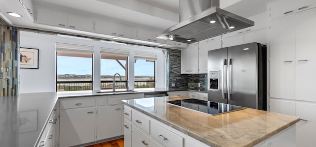 6714 Mtn Trl, Austin, TX 78732 - kitchen featuring stainless steel appliances, wall chimney exhaust hood, a sink, a center island, and white cabinetry