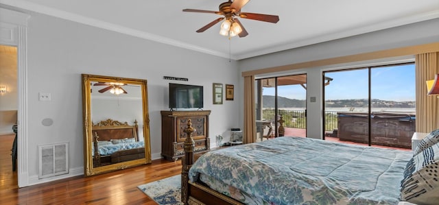 6714 Mtn Trl, Austin, TX 78732 - bedroom featuring access to outside, wood finished floors, baseboards, ornamental molding, and ceiling fan