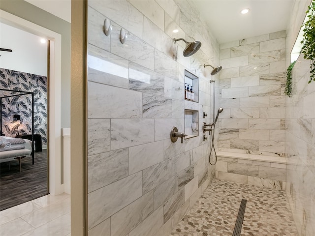 bathroom with tiled shower and recessed lighting