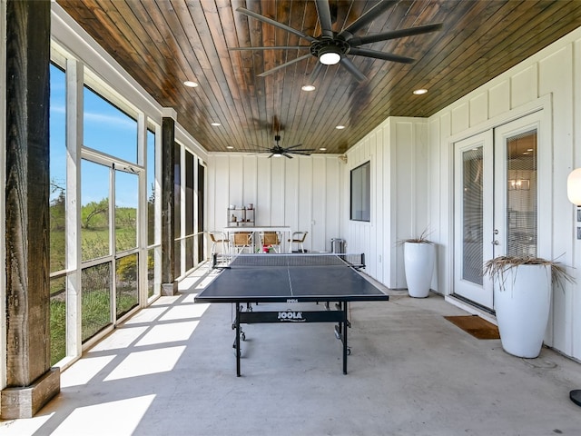 game room with a ceiling fan, concrete flooring, recessed lighting, and wooden ceiling