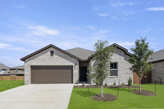 french country inspired facade with a front lawn, brick siding, and an attached garage