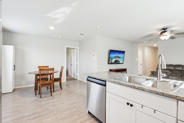519 Mallow Dr, New Braunfels, TX 78130 - kitchen with a sink, stainless steel dishwasher, baseboards, and recessed lighting