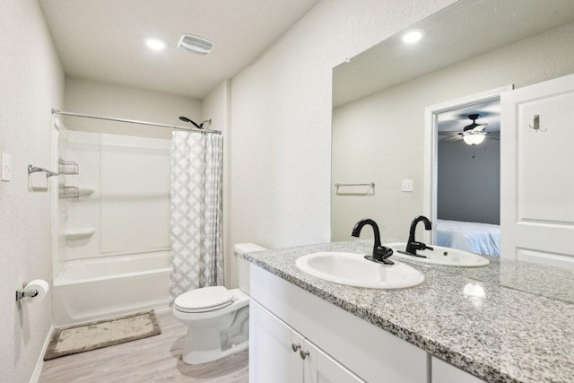 519 Mallow Dr, New Braunfels, TX 78130 - bathroom with toilet, wood finished floors, vanity, a ceiling fan, and connected bathroom
