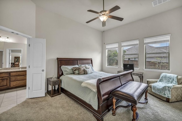 3821 Tordera Dr, Austin, TX 78738 - bedroom featuring visible vents, ceiling fan, light carpet, light tile patterned floors, and connected bathroom