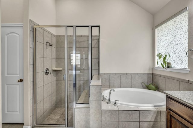 3821 Tordera Dr, Austin, TX 78738 - bathroom with a shower stall, a garden tub, and vanity