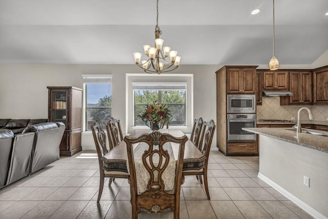 3821 Tordera Dr, Austin, TX 78738 - dining room featuring an inviting chandelier, light tile patterned floors, baseboards, lofted ceiling, and recessed lighting