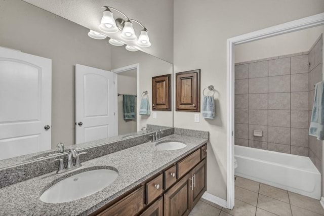 3821 Tordera Dr, Austin, TX 78738 - bathroom featuring baseboards, tile patterned flooring, double vanity, and a sink