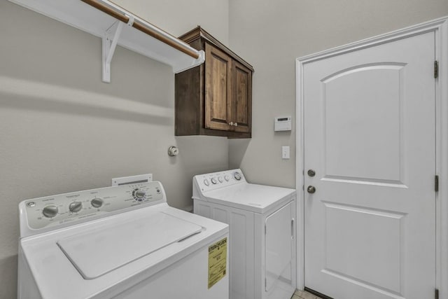 3821 Tordera Dr, Austin, TX 78738 - laundry area with washer and dryer and cabinet space