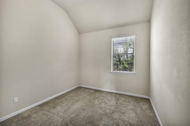 3821 Tordera Dr, Austin, TX 78738 - carpeted spare room featuring vaulted ceiling and baseboards