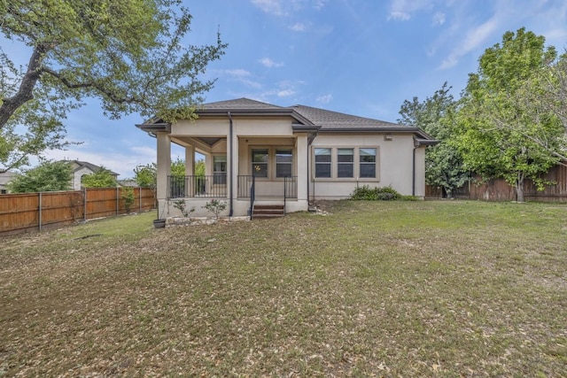 3821 Tordera Dr, Austin, TX 78738 - back of house featuring a fenced backyard, stucco siding, a porch, and a lawn