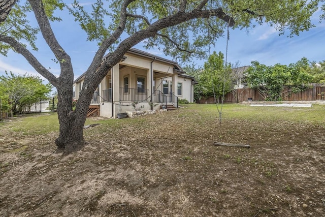 3821 Tordera Dr, Austin, TX 78738 - view of yard featuring covered porch and fence