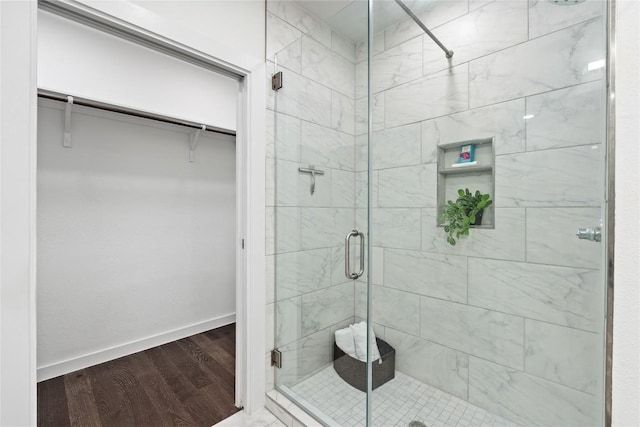 900 S 1st St S Unit 404, Austin, TX 78704 - full bathroom with a shower stall, wood finished floors, and a walk in closet