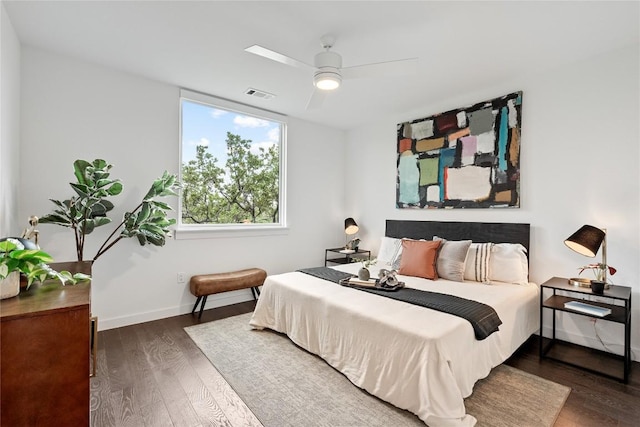 900 S 1st St S Unit 404, Austin, TX 78704 - bedroom featuring wood finished floors, baseboards, and ceiling fan