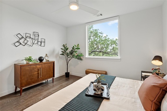 900 S 1st St S Unit 404, Austin, TX 78704 - bedroom featuring wood finished floors, baseboards, and a ceiling fan